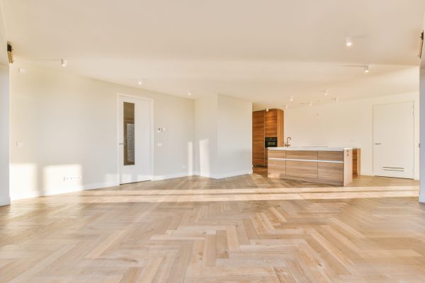 Modern room with wooden floor and white walls